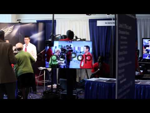 Crew members of One America News Network work at their bo... 8 Crew members of One America News Network work at their bo…