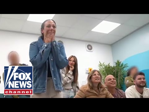 Wife of Hamas hostage jumps for joy watching release