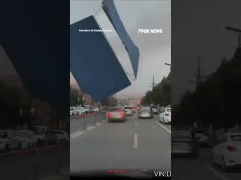 Powerful winds RIP steel roof onto vehicles in China #foxnews #news #shorts #china #weather